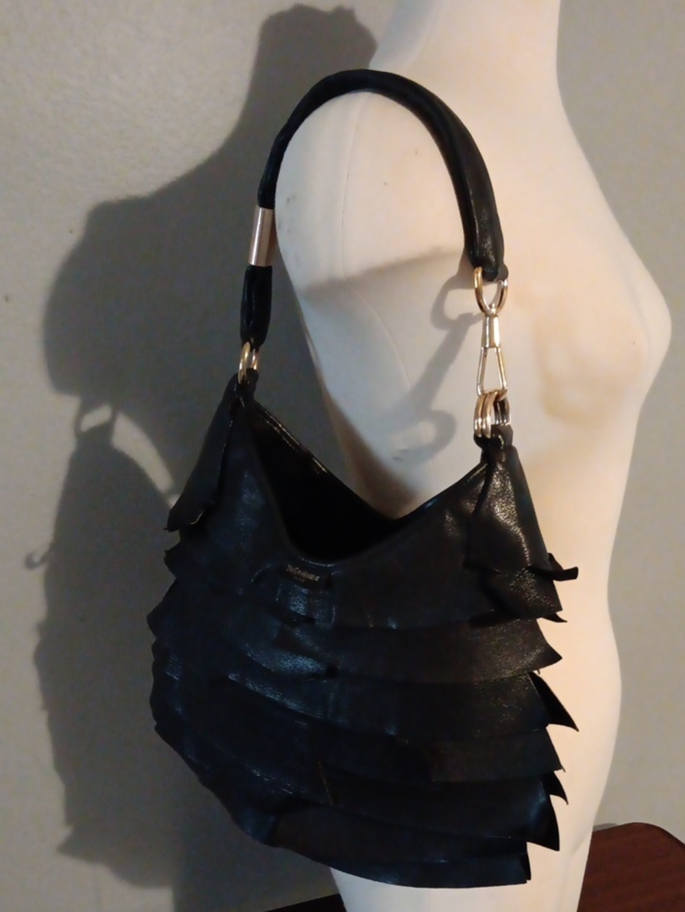 Saint Laurent St. Tropez Ruffled Hobo Bag.